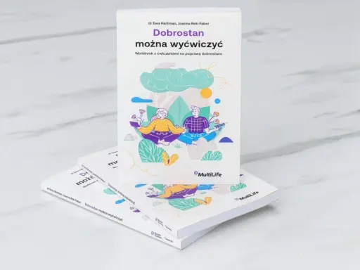 Książka "Dobrostan można wyćwiczyć" z ilustracją pary medytującej. Pomaga żyć i szczęśliwym być.